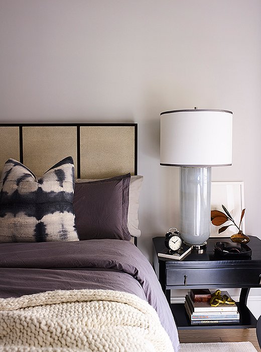 A shagreen-paneled bed by Mr. and Mrs. Howard takes center stage in the bedroom. Oversize nightstands and lamps match its king size. 
