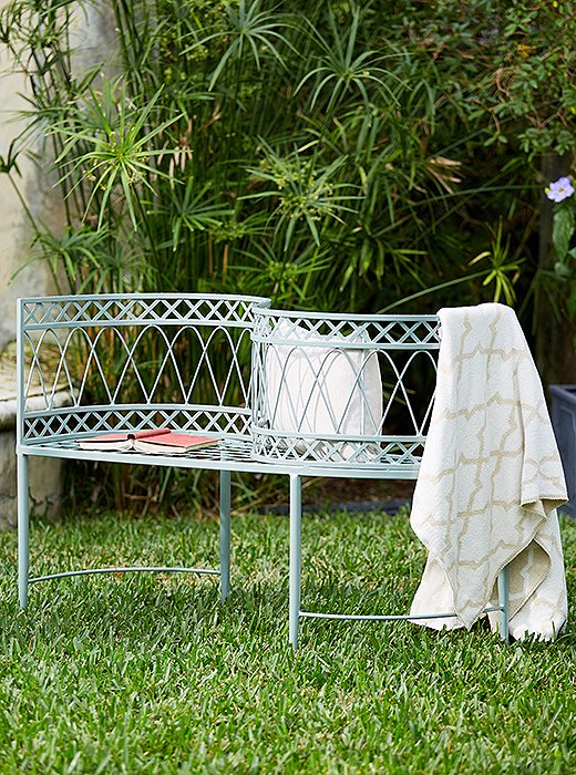 The Linden tête-à-tête, part of our exclusive outdoor collection, features delicate ironwork and makes for a unique addition to the backyard or the patio. 
