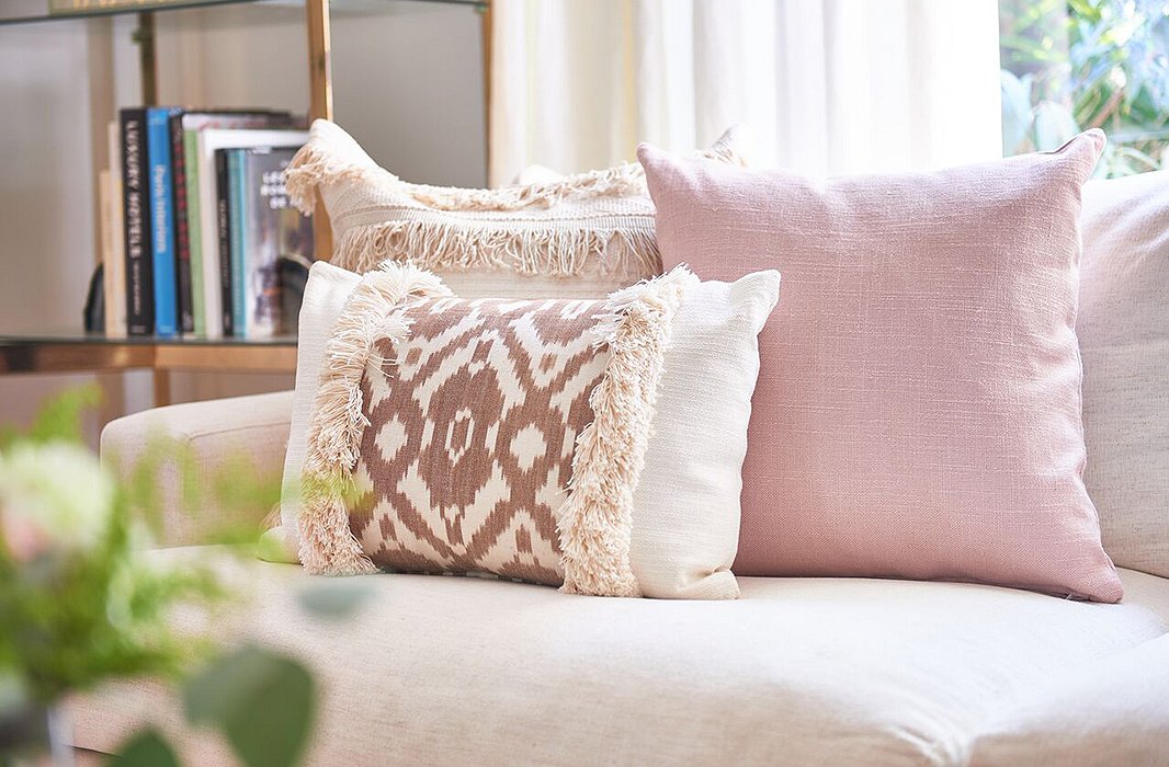Kim Salmela pillows are made to be mixed and matched. Case in point: this harmonious medley of ikat, solid, and fringe.
