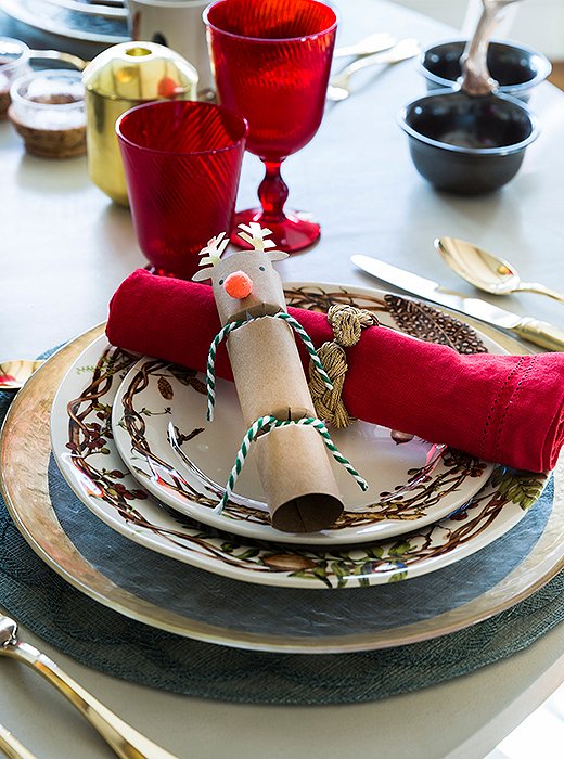 A delightful surprise on Christmas morn: Each of the breakfast table’s place settings hosts a Rudolph-shape cracker.
