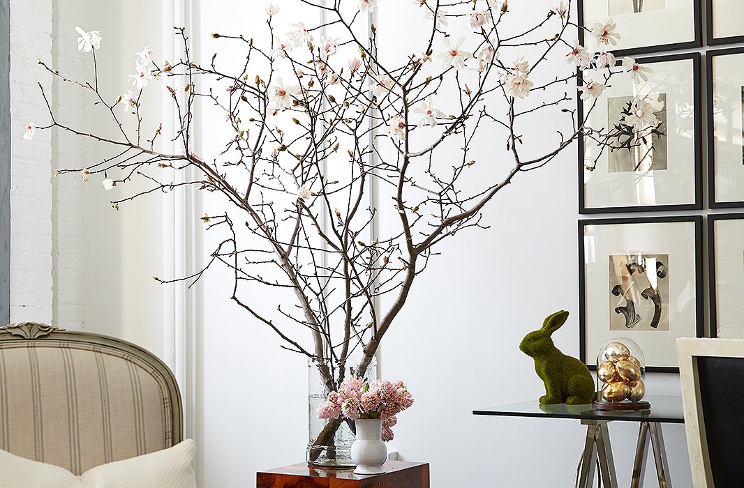 Set in a simple glass vase, these Japanese magnolia branches are the very essence of spring—especially when paired with pale-pink hyacinths and a charming rabbit figurine.
