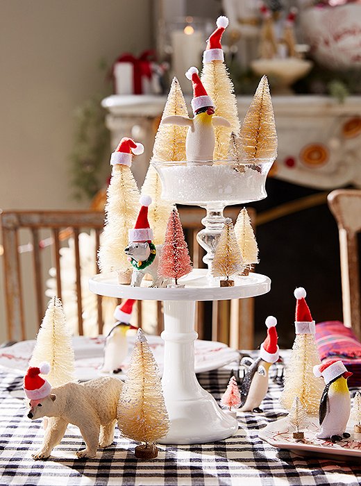 Bring a magical touch to your centerpiece with wintry critters, faux snow, and Santa hats. 
