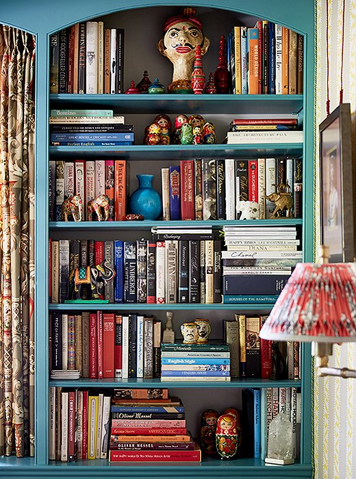 In John and Jason’s library, bookshelves are lined with good reads and prized possessions from around the world.
