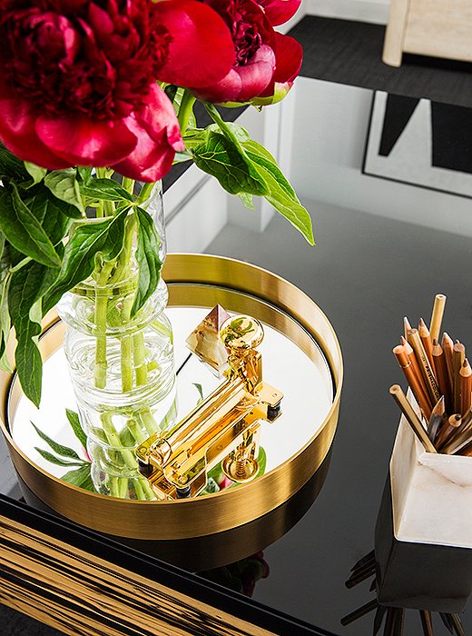 Everyday office supplies don’t have to be drab. A glimmering gold stapler and metallic pencils add a little glamour to the workday.
