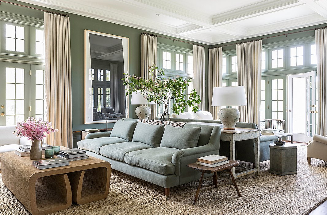 An architectural coffee table, like the Frank Gehry waterfall design shown here, adds a sculptural elegance to the room. Photo by Lesley Unruh.
