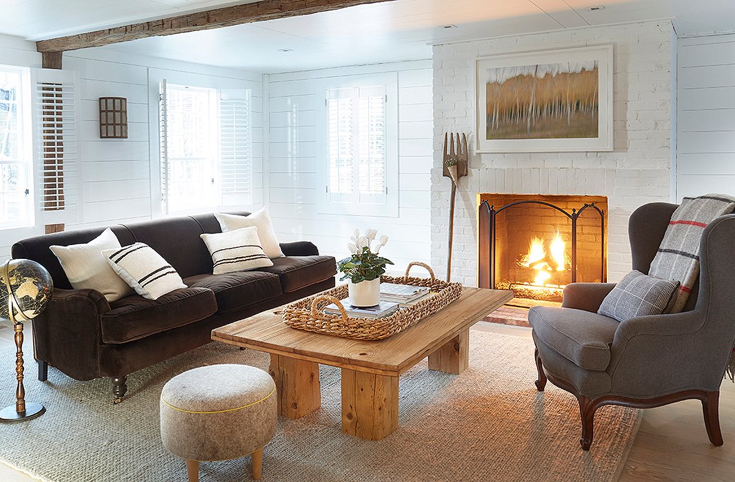 A fire roars in the Townsend room, beside a wingback chair upholstered in gray wool. On the far wall, a sconce by Pergola is consistent with those installed elsewhere on the property. “If it works, why change it?” Nikki asks.
