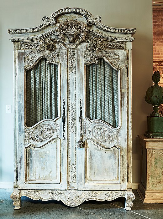 Each piece tells a story: This 19th-century carved French armoire was made as a wedding gift from a father to his newly married daughter.
