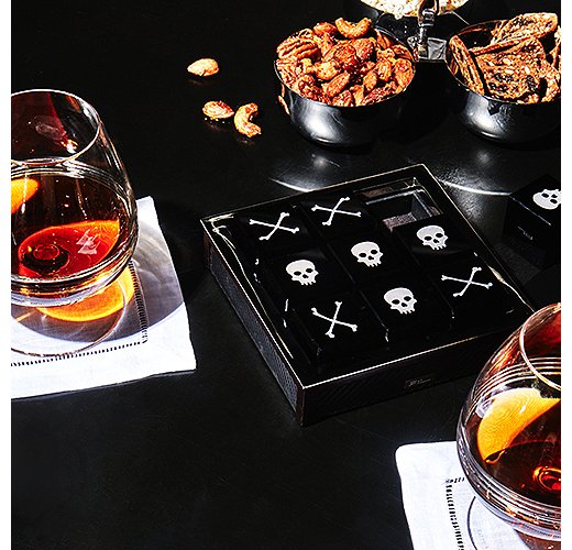 A luxe tic-tac-toe set helps while away the hours until midnight.
 
