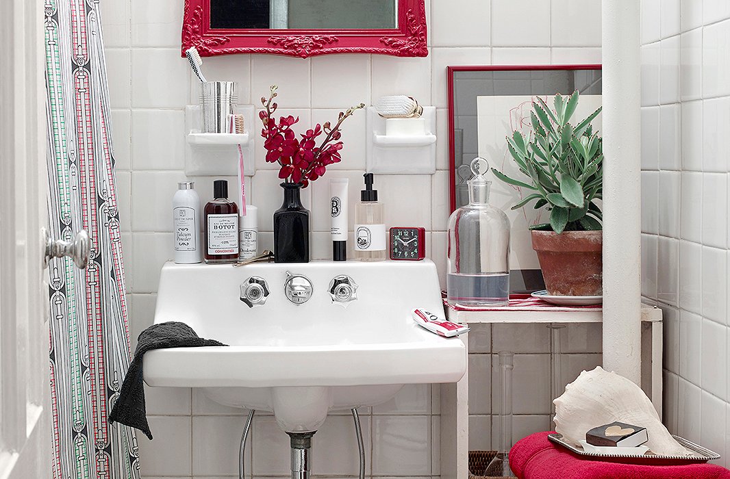 Vanity lessons: Simple touches like a fancier bottle of Botot mouthwash (the brand was a favorite of Louis XV) and a brush in a silver cup are easy ways to elevate the look of any bath. 
