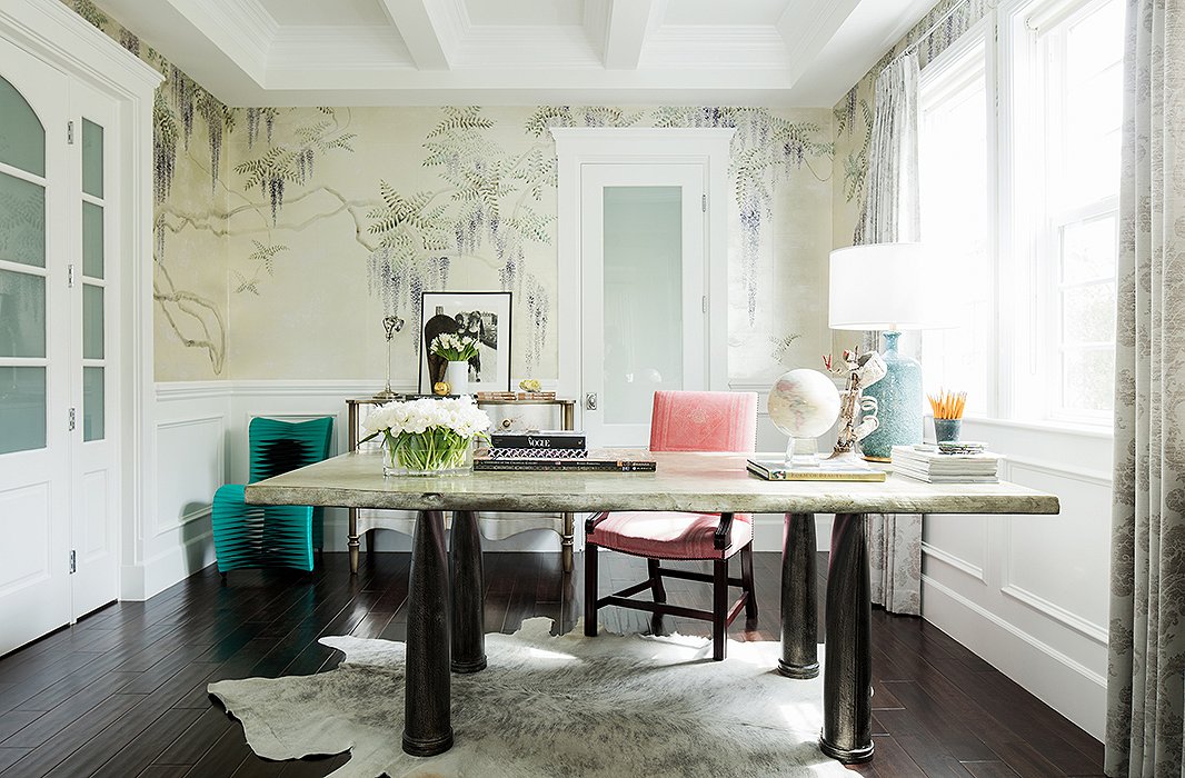 The centerpiece of the office is a stone-top dining table, which Rachel found on our site, that functions as her desk. The hide rug is another One Kings Lane find.
