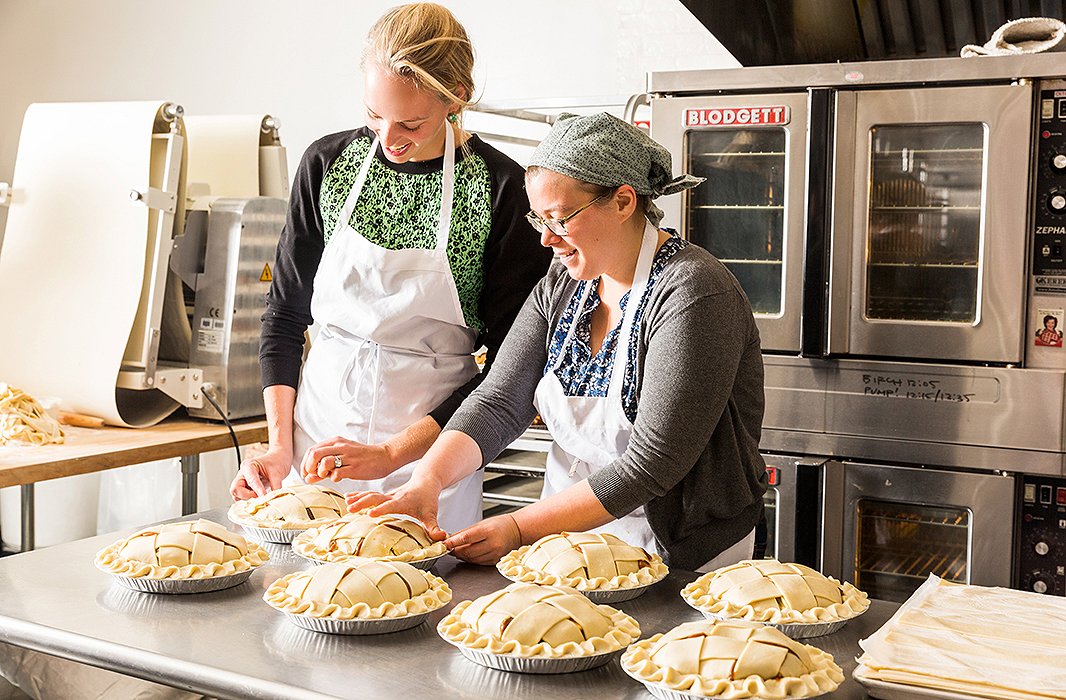 Rica (right) and I finishing a batch of eight pies. Or rather, she finishes seven and I keep working on one.
