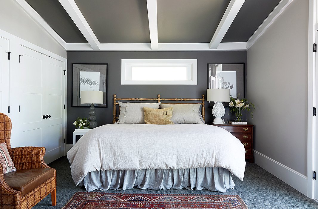 Barbara’s decision to paint the bedroom ceiling dark gray immediately upped the room’s sophistication factor. “I don’t know if this is true,” she says, “but I read somewhere that here in the States, we tend to paint low ceilings white, and in Europe, they tend to paint them very dark, to make them disappear.”
