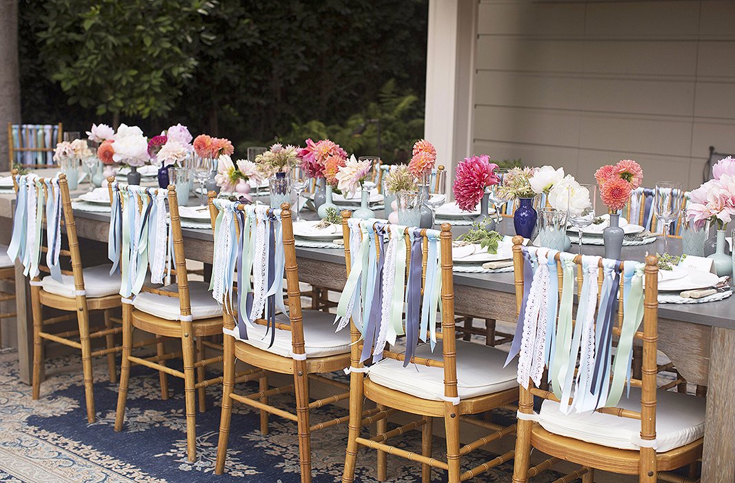 “I wanted to do something to dress the chairs up,” says Susan. “I saw a picture on Pinterest of a wedding where they used ribbons on the chair. It looked so pretty and felt like a really fun ode to summer and something that could be easily tailored to work for my color story.”
