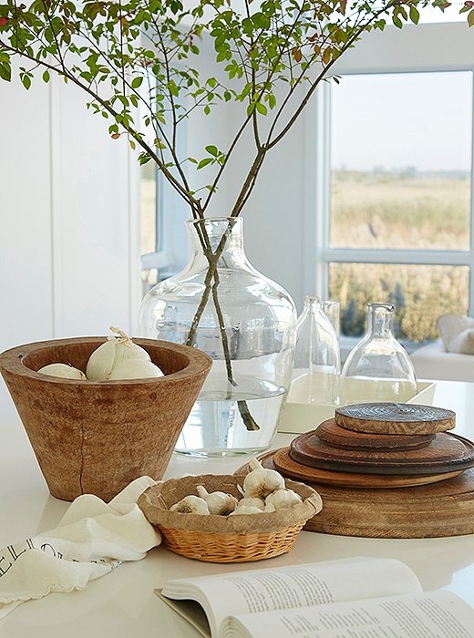 Beauty while you work: A stack of cutting boards and a basket filled with onions are the perfect finishing touches.
