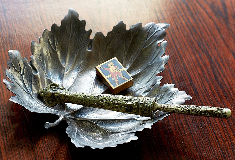 A vintage matchbox, found at an estate sale when he was 17 years old, earns a spot in Shawn’s display, as does a swordlike letter opener, another estate-sale find.
