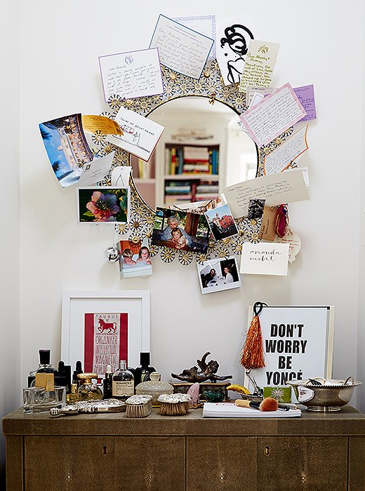 The vanity in the master bedroom is a place of memories: favorite perfume bottles, silver brushes from Amanda’s grandmother, photos and notes from close friends, and a Beyoncé print from her daughter after they attended a concert together.
