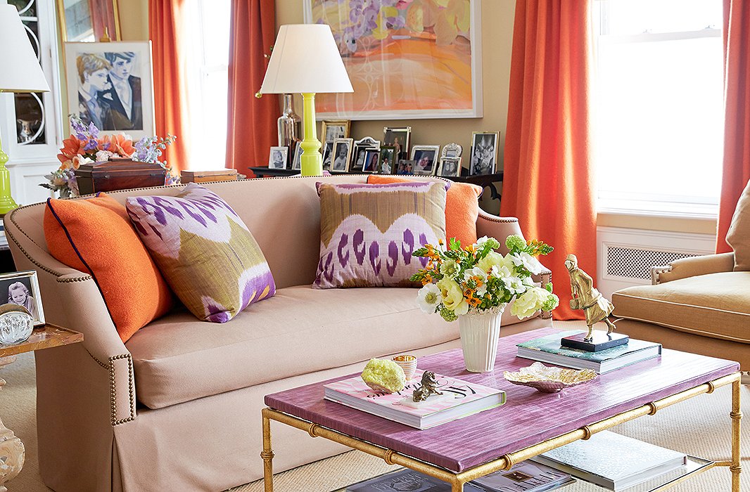 Brilliant colors lead the way in the ever-changing living room (“It’s a hazard of the profession”), starting with the punchy orange boiled wool by Holland & Sherry used on the curtains and pillows and the purple leather-top table designed by Amanda for Niermann Weeks.
