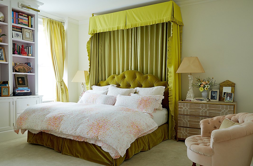 The bedroom is Amanda’s haven, although color finds its way inside. “I believe in a soft palette for the bedroom, but I’m not one to do all white for myself,” she says. The walls are painted in Farrow & Ball’s Pointing, and the green bed curtains are made with Manuel Canovas and Fortuny fabrics.
