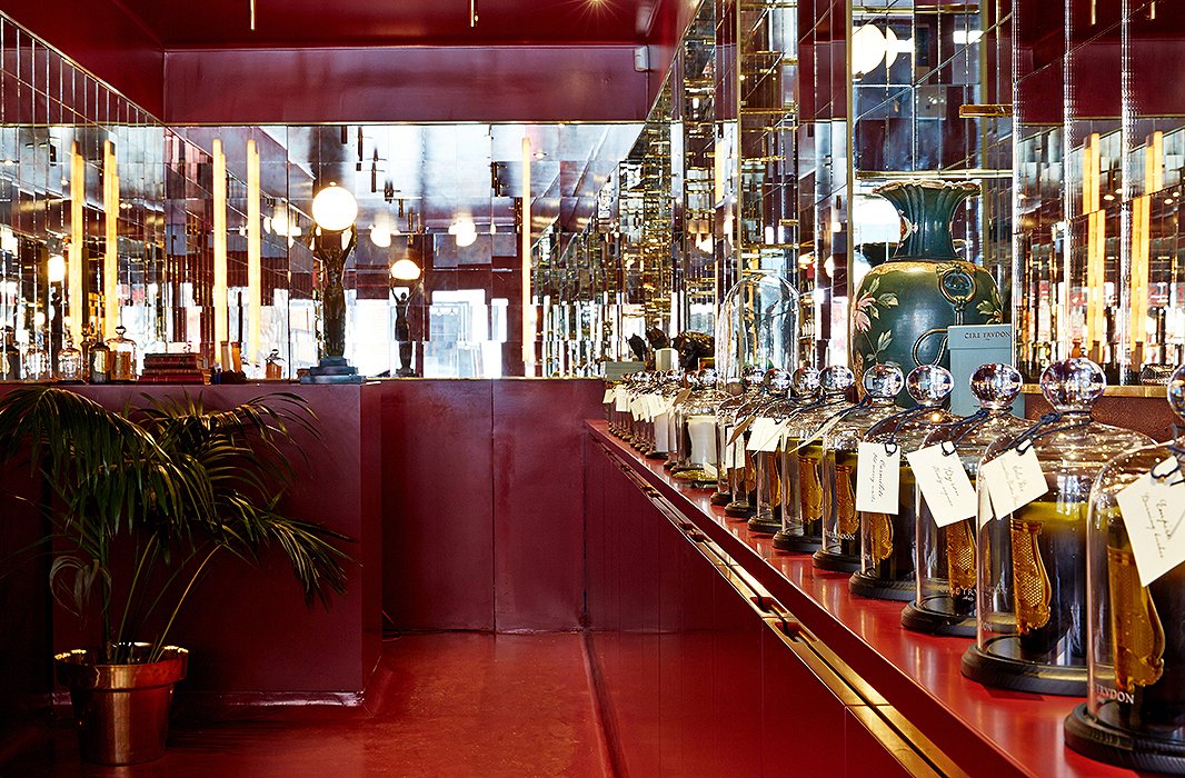 The shop’s glimmering mirrored interior, a nod to the lavish halls of Versailles, is lacquered in a burgundy reminiscent of wax seals.
