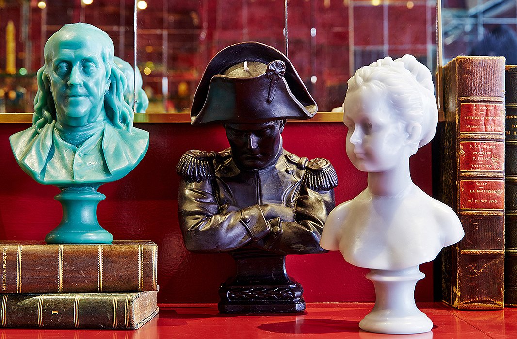 Cire Trudon’s nonscented wax candles include busts sculpted in the form of renowned figures such as Napoleon Bonaparte. Vintage books by famous French authors, from Voltaire to Camus, make aptly refined decor. 
