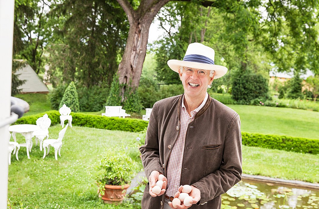 Elizabeth’s husband, John Staelin, after collecting fresh-laid eggs from their chicken coop.
