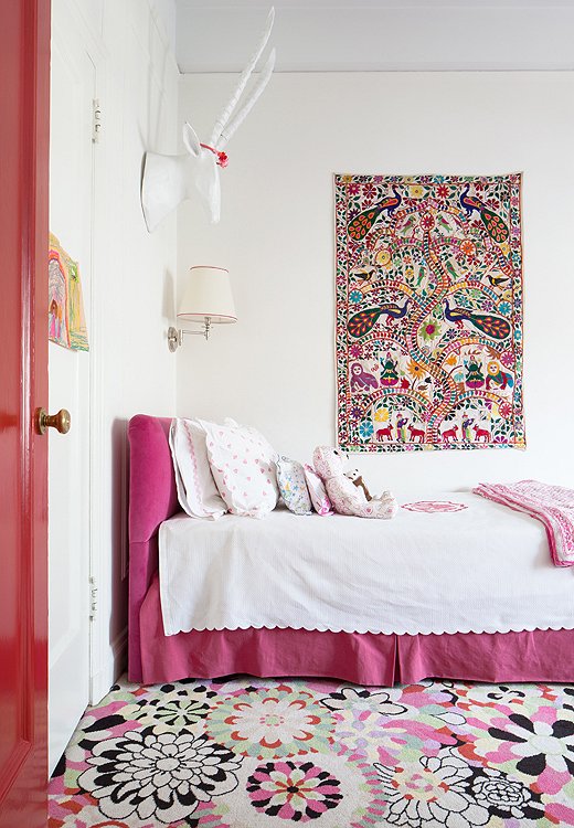 A subtly scalloped duvet, a pleated bed skirt, layers of pillows: Here, it's the details that make the space feel a touch more sophisticated.  Photo by Lesley Unruh.  