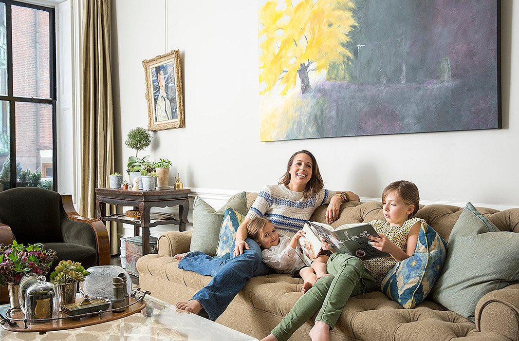 Working from home, Nina gets to spend lots of time with her daughters, eight-year-old Quinn and five-year-old Colette. The painting above the sofa is by Nina’s artist mother, Mira Goldberg.
