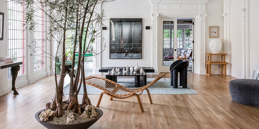 Brigette’s living room is a study in “the mix.” Modern lines find a home among the intricate molding, feeling perfectly situated in the airy space she has curated. Photo by Shade Degges. 
