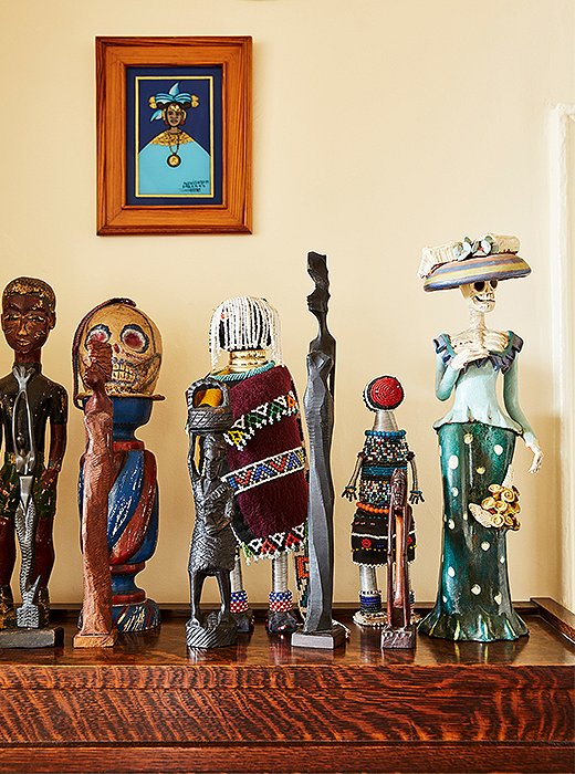 Figures found while traveling stand on top of a cabinet. Some were found in Mexico, where Hardison has two other homes, and represent her affinity for the country and the culture she’s experienced there. “You’ve got to have something from Day of the Dead,” she quips. 
