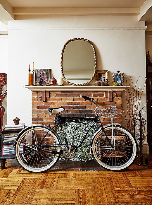 Left on view, Hardison’s bike takes on a sculptural quality in front of the fireplace.
