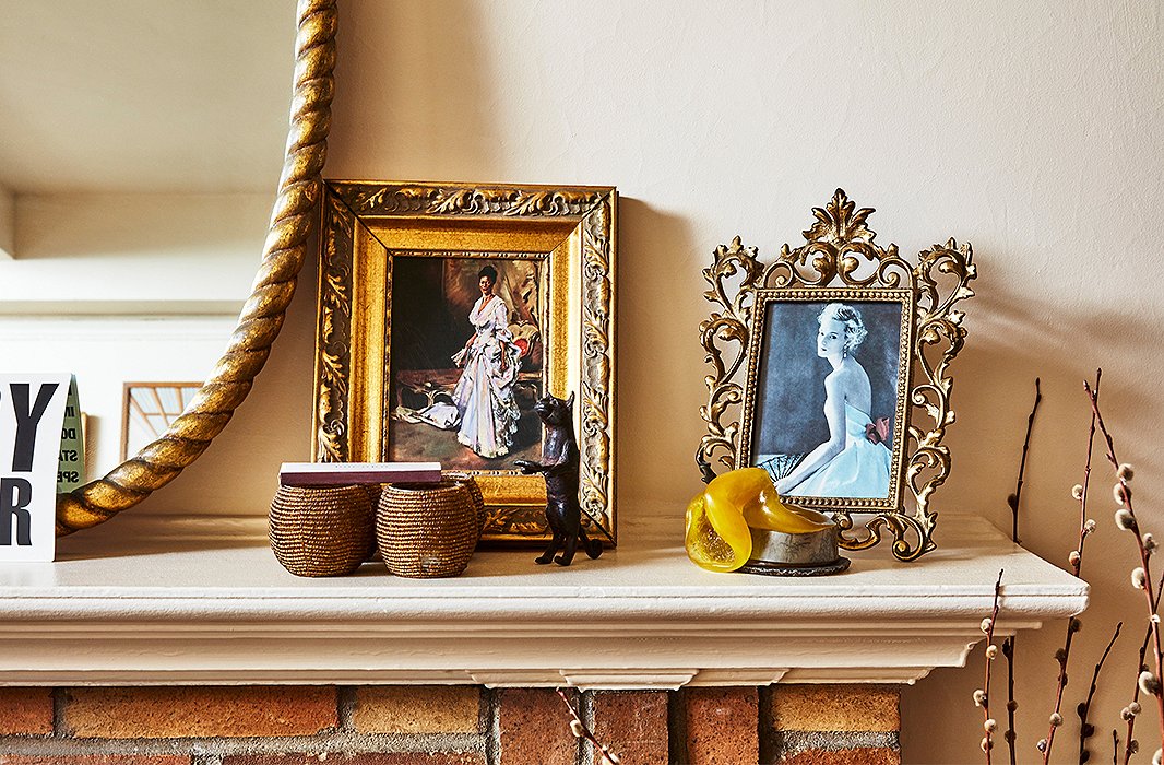 Photographs and mementos hold court on the mantel.
