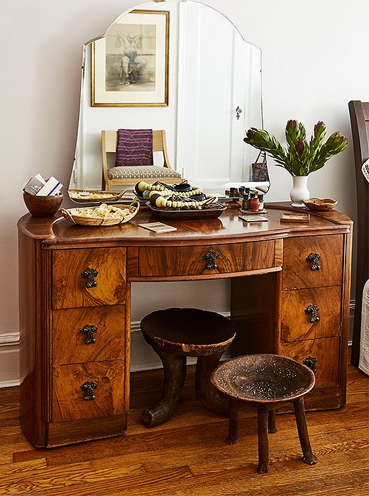 A vintage vanity plays host to more of Hardison’s jewelry, left on display but organized by way of baskets and bowls. 
