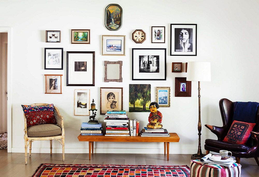 Shiva’s ever-evolving salon-style wall—backed by her favorite “warm but not fluorescent” white paint, Benjamin Moore’s Swiss Coffee—comes off as chic rather than cluttered. Her secret? Wide white mats edging many of the pictures “air out” the artscape so that it doesn’t overwhelm. “A friend came over when I was arranging my art wall—I’d hold pieces up, and she’d say yes or no. I highly recommend a second opinion.”
