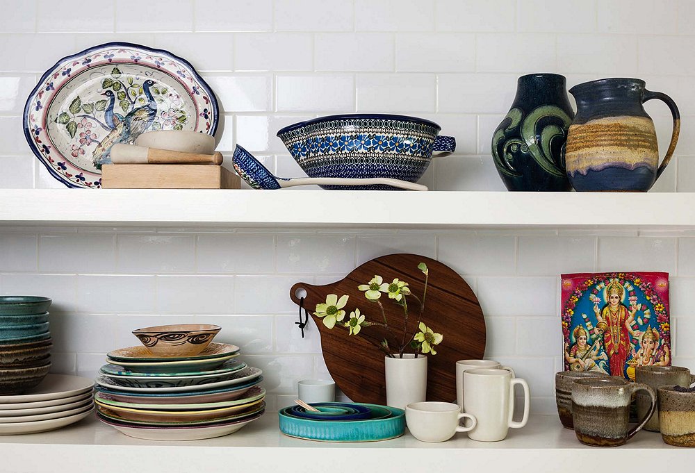 “I love how it can be both decorative and functional,” says Shiva of her open shelving, which spotlights a serveware collection that includes vintage sake vessels and mugs from Big Sur, a favorite getaway spot. “It also saves time,” she adds. “You don’t have to open cabinets and dig around to get something—everything is right there at your fingertips.”
