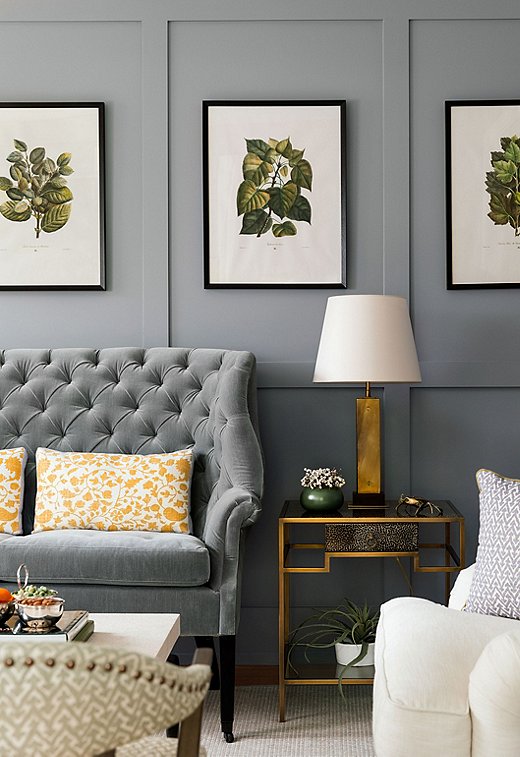 The choice to go dark in the formal living room was actually client-led. “I usually have to do a lot of arm-twisting when it comes to strong colors,” says Chauncey. She chose to lighten the space up with whites, marigolds, and greens.
