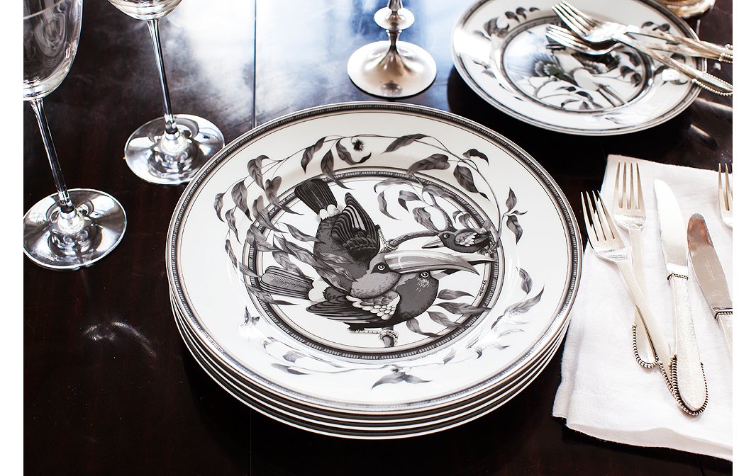 

For fancier evenings, Chantecaille pulls out her set of Hermès china. The shades of gray complement the loft’s tones perfectly—and let the food shine.


