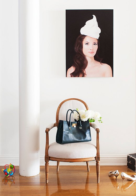 A striking portrait of Olivia by New York painter Will Cotton, a close friend, energizes an otherwise simply decorated portion of the hallway.
