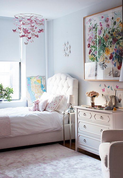 Delphina’s bedroom is unabashedly feminine, but it’s worth noting that the same palette of grays and whites used in the living room extends to the nursery.
