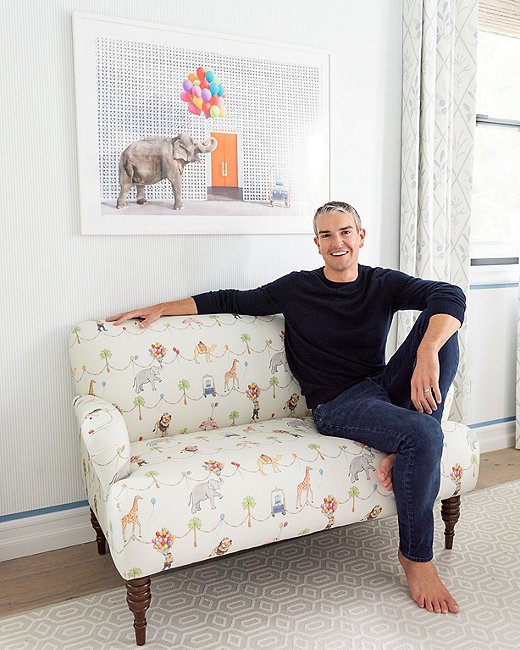 Photographer Gray Malin in front of a shot from his Gray Malin at the Parker series, which inspired the designs in his new collaboration with Cloth & Company. Photo by Ryan Garvin.
