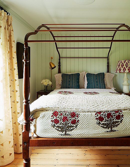 Heide paired delightful block-print accents with this antique canopy bed. 
