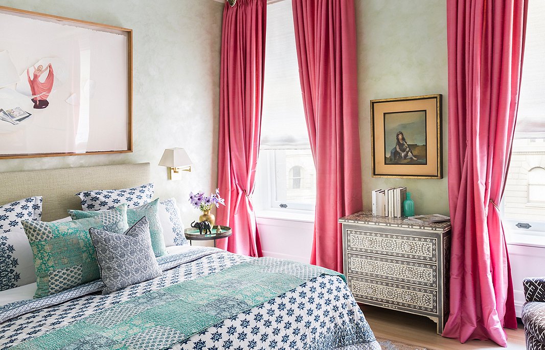 Velvety Venetian-plaster walls give the master bedroom a sense of serenity. “You don’t want something too unharmonious in your bedroom—you don’t want something that doesn’t calm you,” Roberta says. One bold stroke: the magenta silk curtains, another part of her haul from the Bangkok market.
