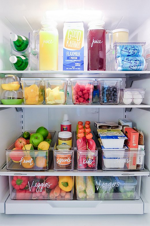 Clear—and clearly labeled—plastic bins ensure you can easily see everything in your fridge (no forgotten leftovers here!).
