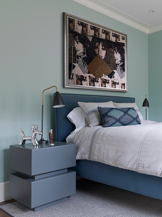 Not every little boy is lucky enough to have a painting of Mick Jagger in his room, let alone one painted by Andy Warhol. Heather added more funky modern touches with patterned bedding and pillows. The Jeff Koons dog is another nod to the family’s love of modern art. Find a similar bed here.
