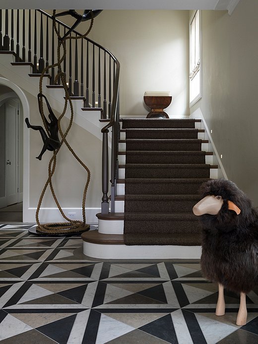 The homeowners found this towering bronze statue by Israeli artist Tolla Inbar while vacationing.  Heather paired it with a sheep to make a whimsical statement in the foyer.
