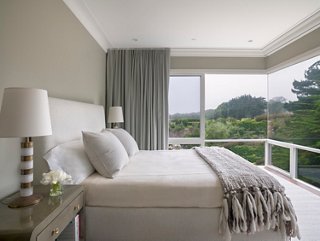 The master bedroom, painted a light celadon, is devoid of art or many accessories because the homeowners didn’t want to distract from the view. On clear days, they can even see the Golden Gate bridge.
