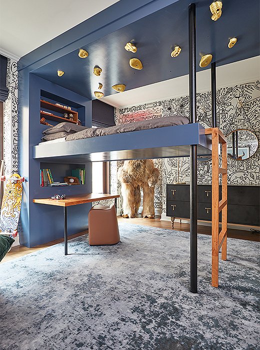 Gabriel and Brooke Anderson of Dean & Dahl dreamt up a kids' bedroom primed for fun. Imaginative touches such as a loft bed encased by a climbing wall, a shaggy figure resembling Bigfoot, and a graffiti-style mural by Utah-based artist Carrie Ellen come together to create a space that lifts the spirits of both young and old.  