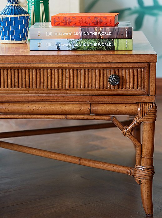 Fine details—pewter-finish drawer pulls, wrapped joints—give this maple-and-rattan coffee table an earthy elegance.
