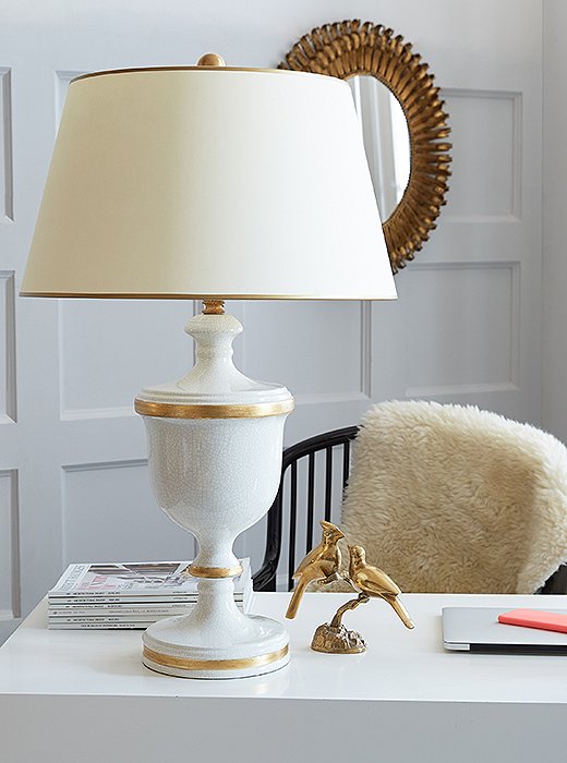 The Pacific Beach Lamp (shown here in gold and white) features a crackled cream glaze and lots of gold (on the body, trimming the shade, and on the finial).
