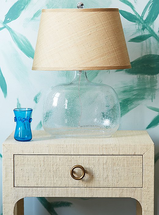 This nightstand is finished in a layer of woven raffia for a richly tactile look. And paired with a bubble-glass base, a raffia lampshade is the ultimate in beachy chic.
