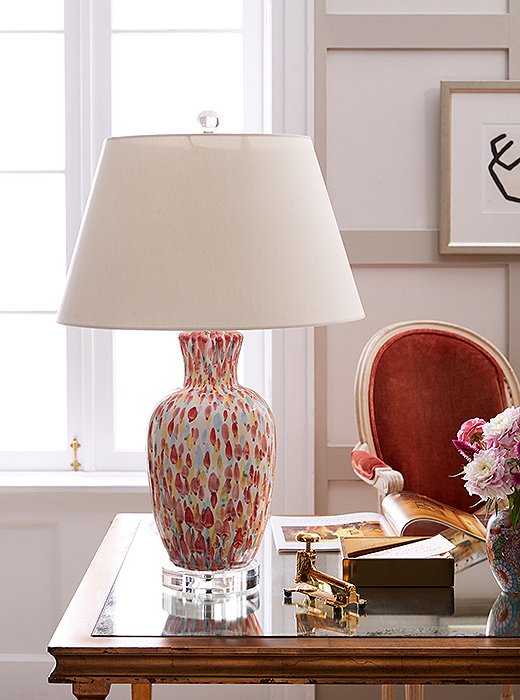 The Pink Petals Table Lamp brings in a bright pop of color and pays subtle homage to floral prints with its petallike pattern.
